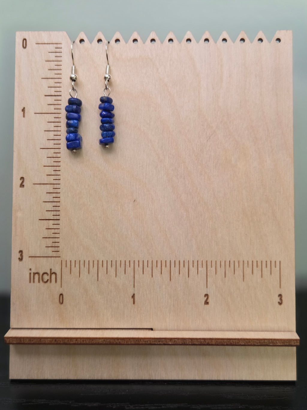 Sodalite chip bead stack earrings displayed on a wooden earring stand with ruler showing approximately 1.5 inch length
