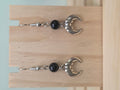 Black onyx beaded earring with silver-tone banded crescent moon charm
