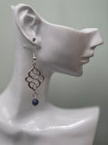 Sodalite swirl knot dangle earrings against ruler showing approximately 2 inch length