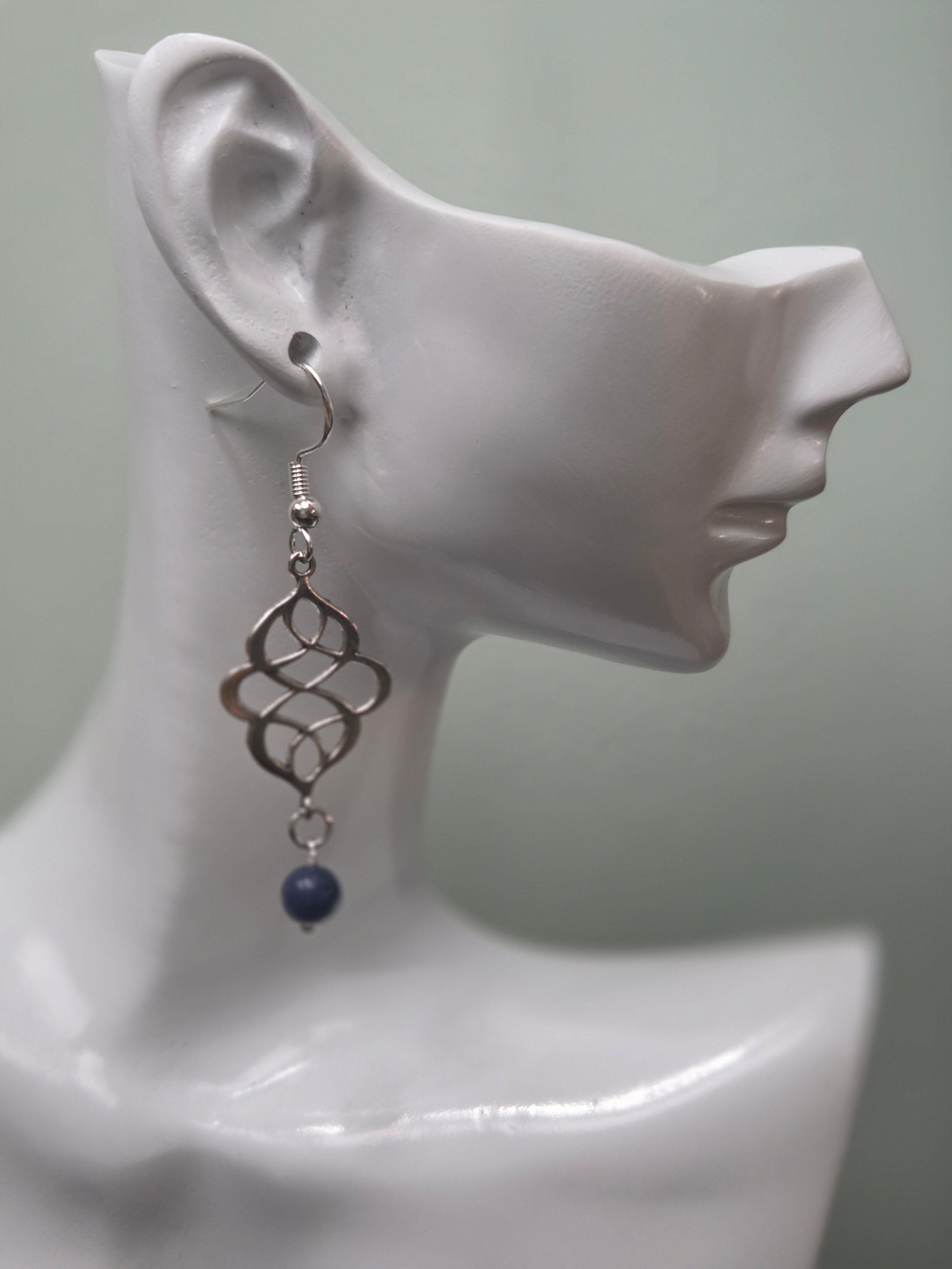 Sodalite swirl knot dangle earrings against ruler showing approximately 2 inch length