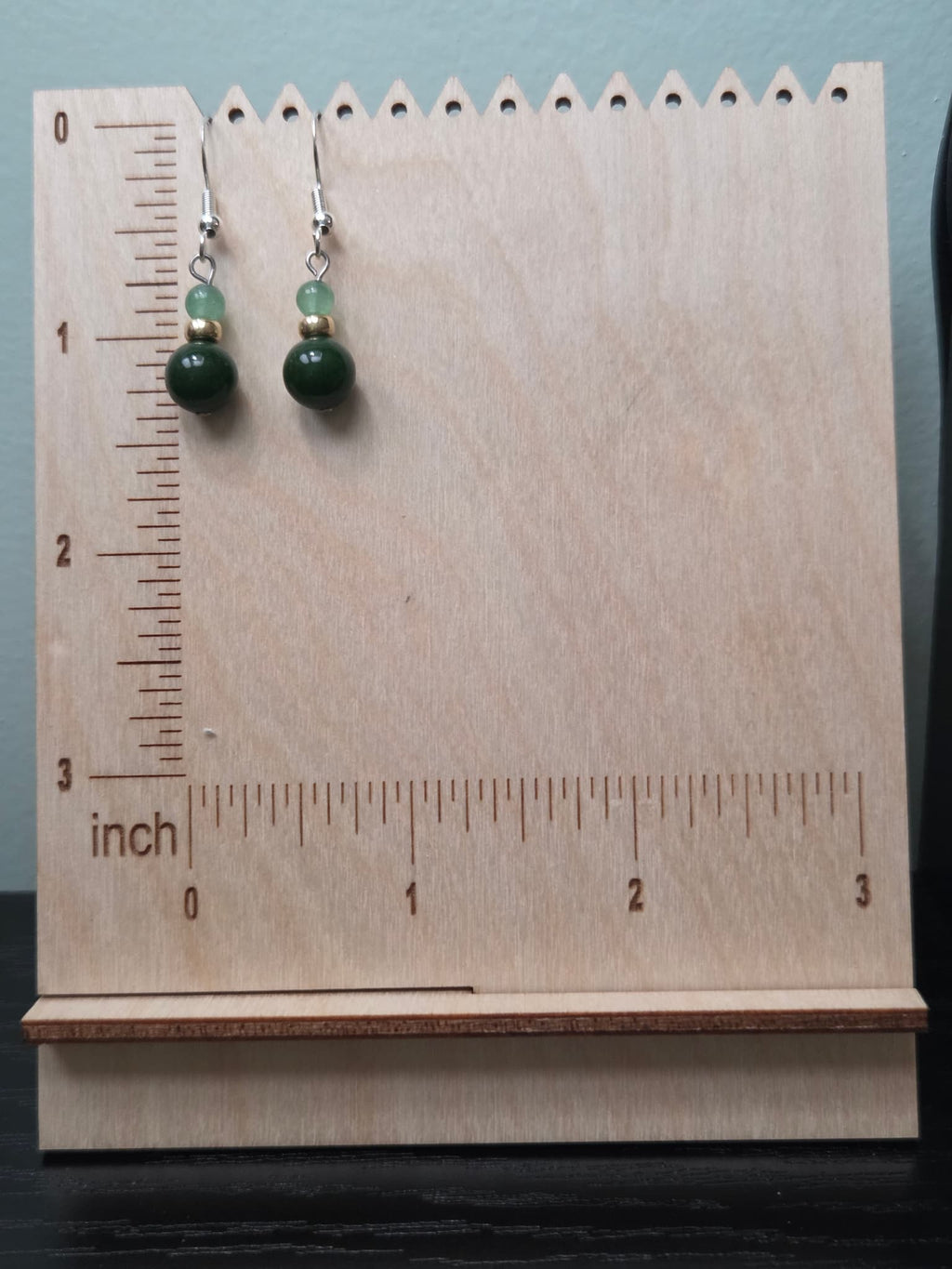 Jade and aventurine drop earrings shown against a wooden ruler, measuring approximately 1.5 inches in length from ear wire to bottom of bead