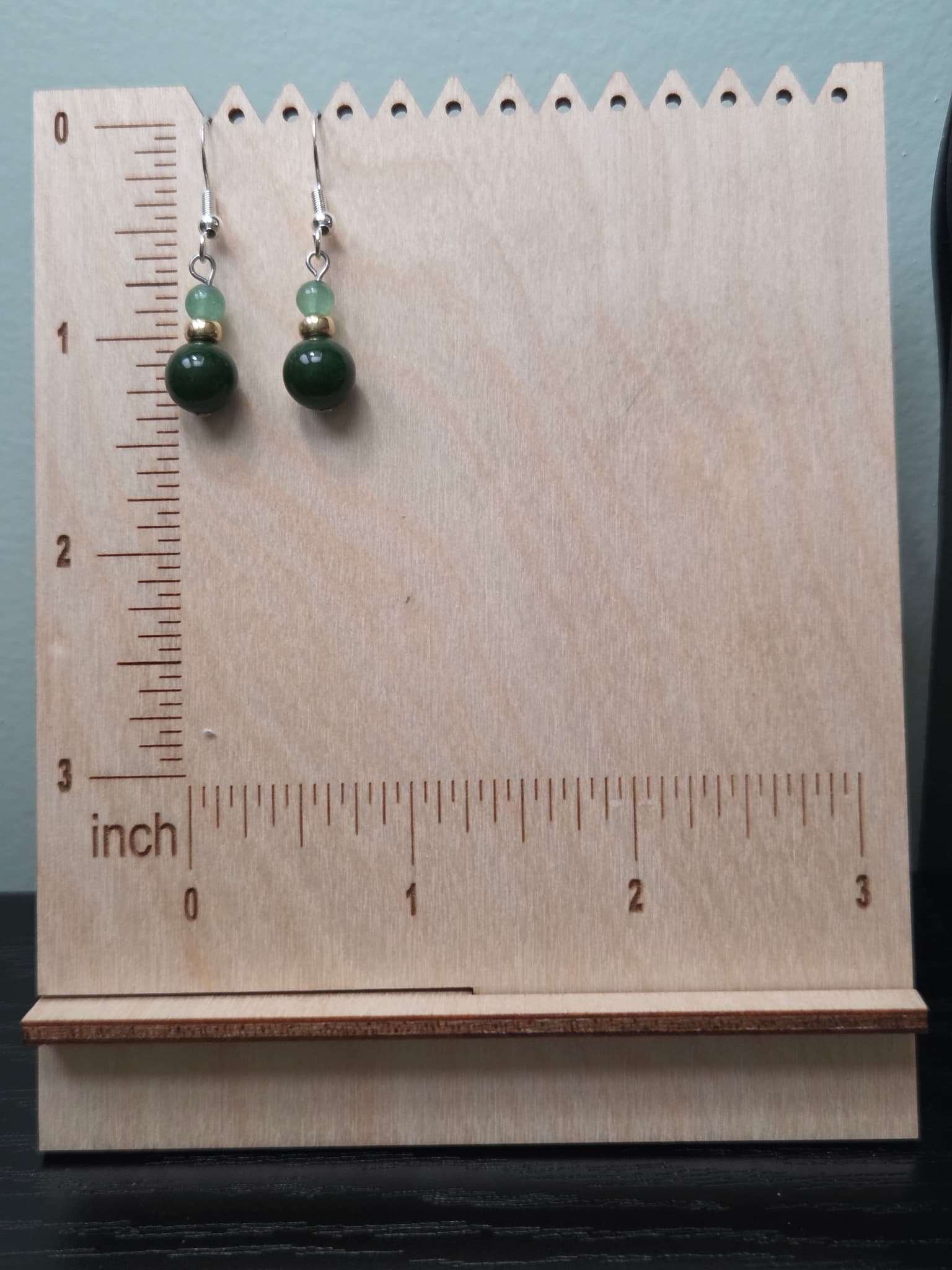 Jade and aventurine drop earrings shown against a wooden ruler, measuring approximately 1.5 inches in length from ear wire to bottom of bead