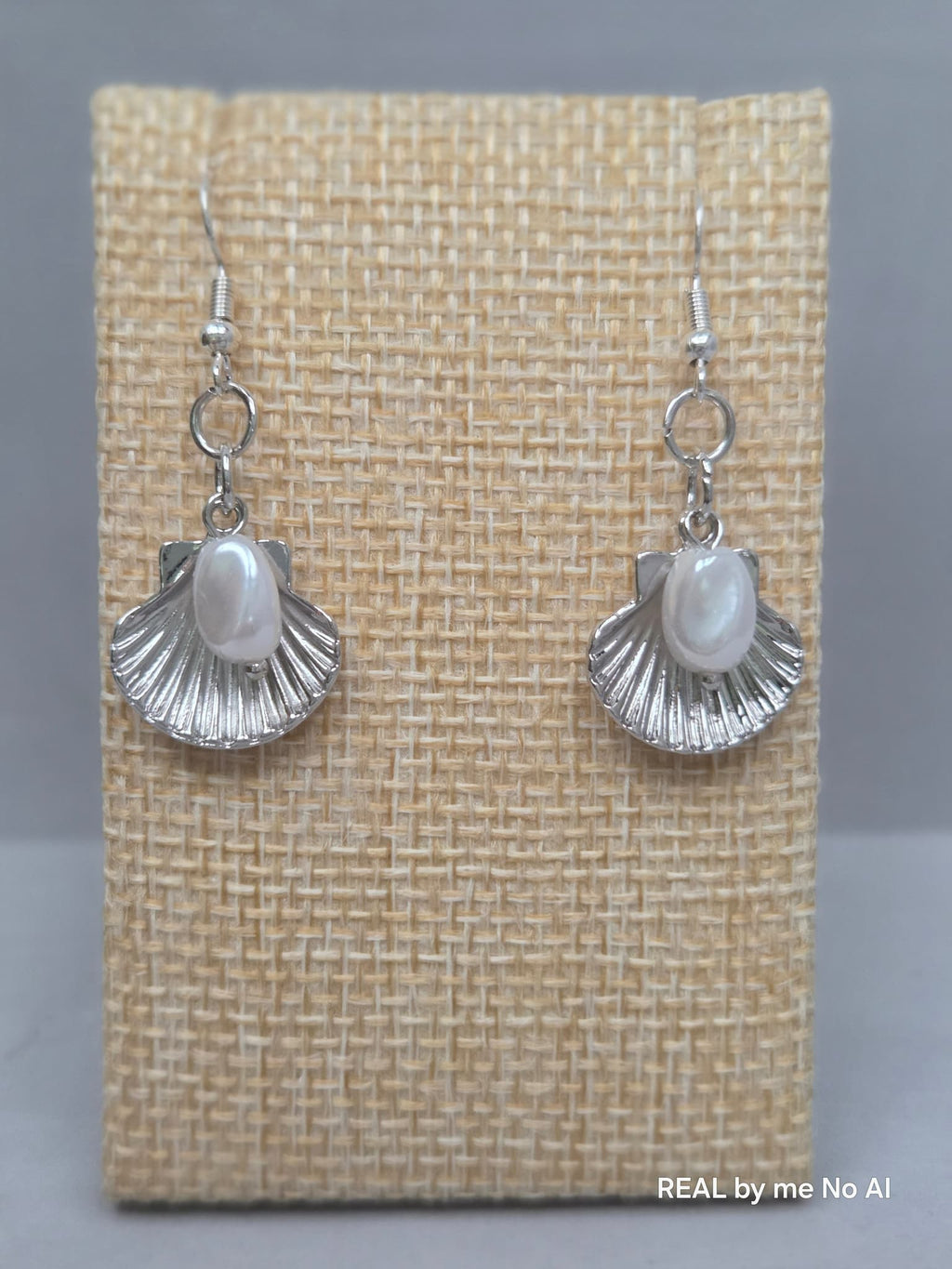 Silver shell and pearl earrings shown with silver-tone ear wires