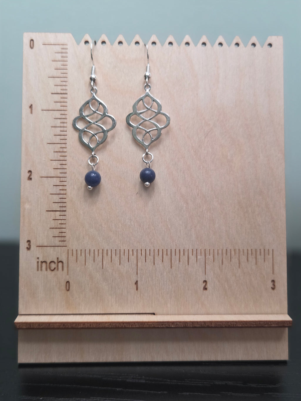 Sodalite swirl knot dangle earrings, silver-tone connector with blue sodalite bead